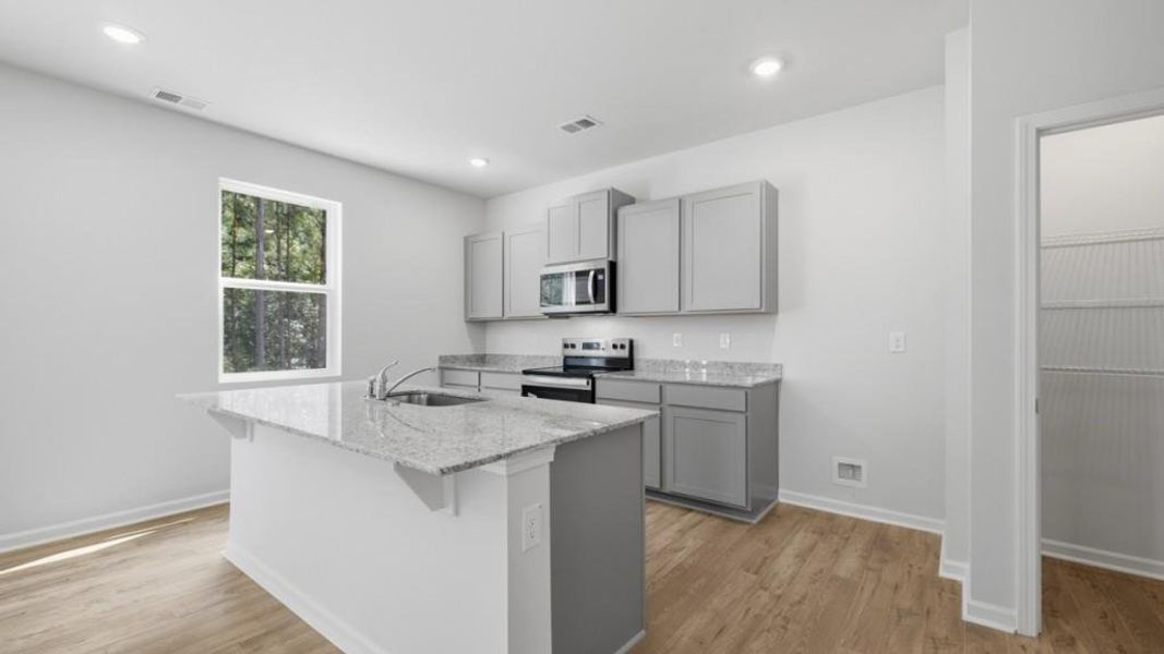 Furnished interior view inside a new home in Oaks at Cedar Grove, Fairburn (Image 6).