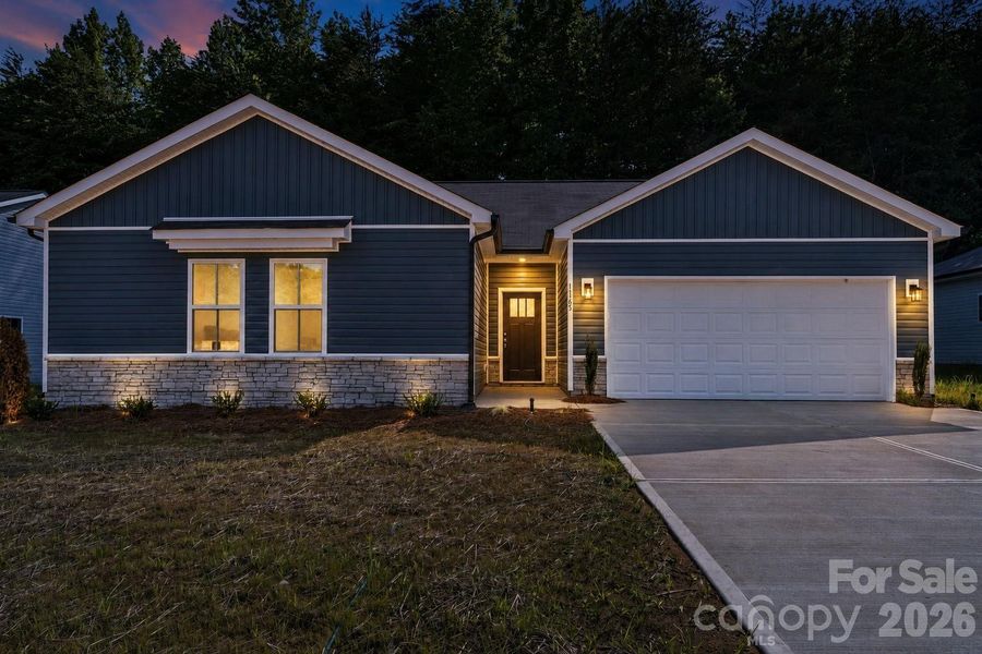 Front exterior of a new home in , Granite Quarry, NC, highlighting curb appeal (Image 2). Front exterior of a new home in , Granite Quarry, NC, highlighting curb appeal (Image 2).