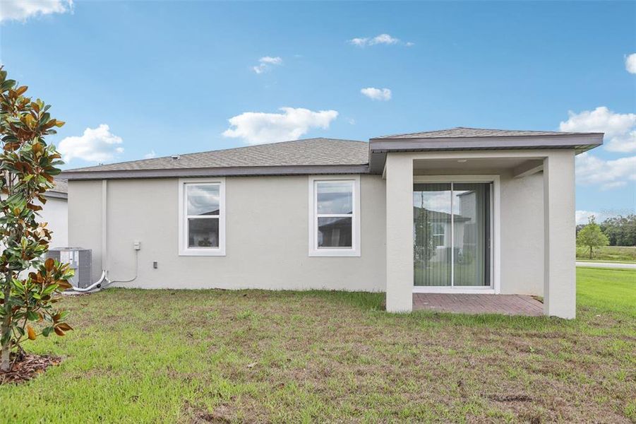 Exterior details and patio area of a home in Springs at Lake Alfred - Signature Series, Lake Alfred (Image 3).