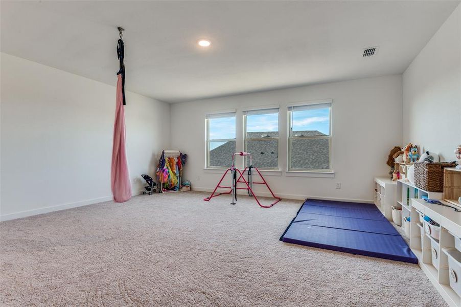 Furnished interior view inside a new home in Prairie Ridge at Goodland, Venus (Image 15).