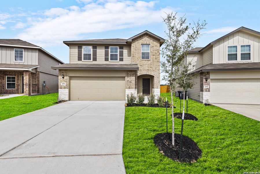 Front exterior of a new home in Winding Creek, New Braunfels, TX, highlighting curb appeal (Image 1). Front exterior of a new home in Winding Creek, New Braunfels, TX, highlighting curb appeal (Image 1).