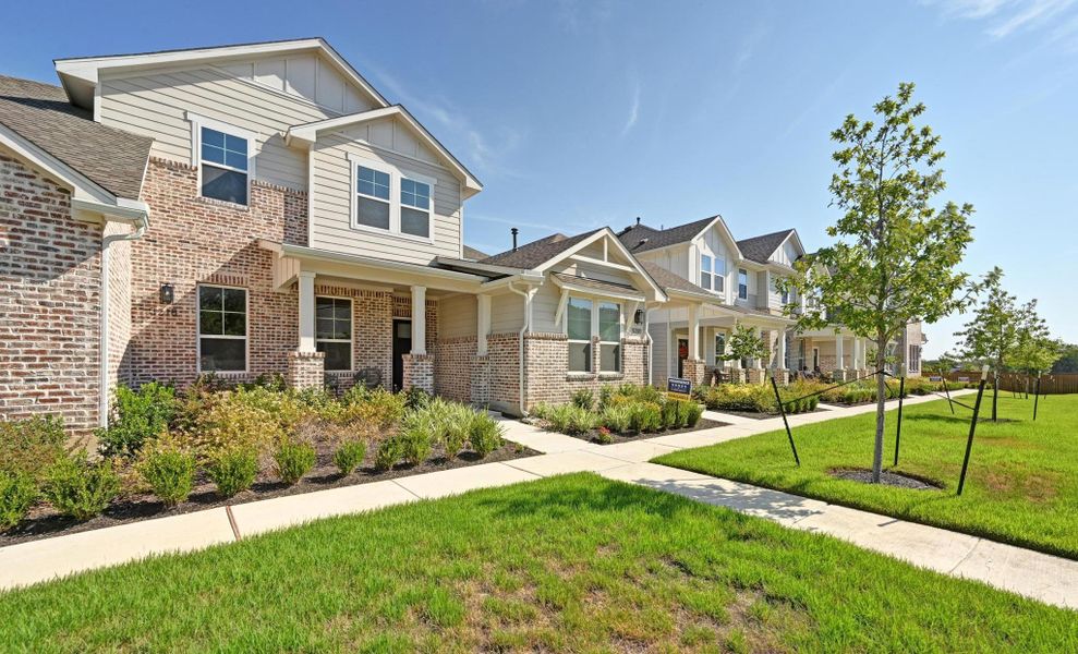 Front exterior of a new home in , Buda, TX, highlighting curb appeal (Image 23).