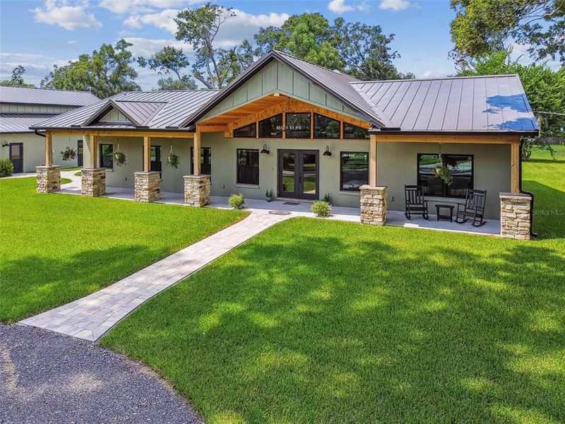 Front exterior of a new home in , Lithia, FL, highlighting curb appeal (Image 1).