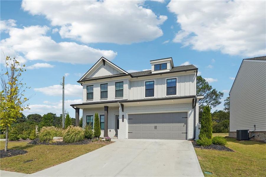 Front exterior of a new home in Westgate Estates, Loganville, GA, highlighting curb appeal (Image 20).