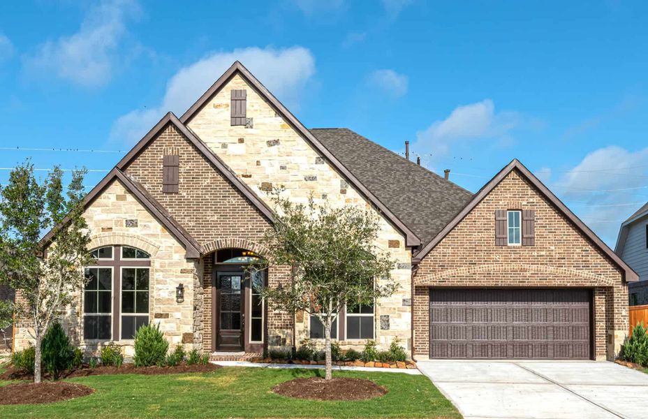 Representative exterior photo of a completed home built from the 4290 by Ravenna Homes in Artavia 70′, Conroe, TX (Image 22). Representative exterior photo of a completed home built from the 4290 by Ravenna Homes in Artavia 70′, Conroe, TX (Image 22).