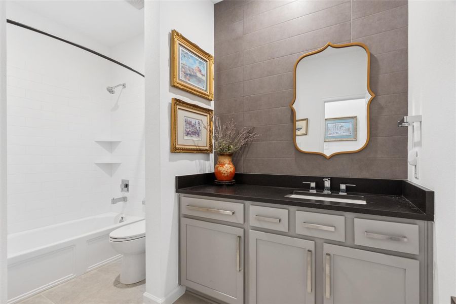 Secondary bathroom with tub and shower combo provided plenty of space for sharing