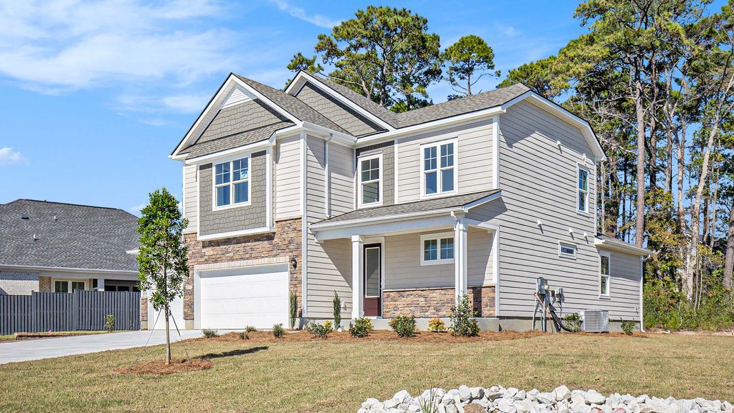 Front exterior of a new home in Belle Park, North Myrtle Beach, SC, highlighting curb appeal (Image 2).