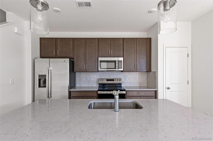 Furnished interior view inside a new home in Turnberry, Commerce City (Image 8).