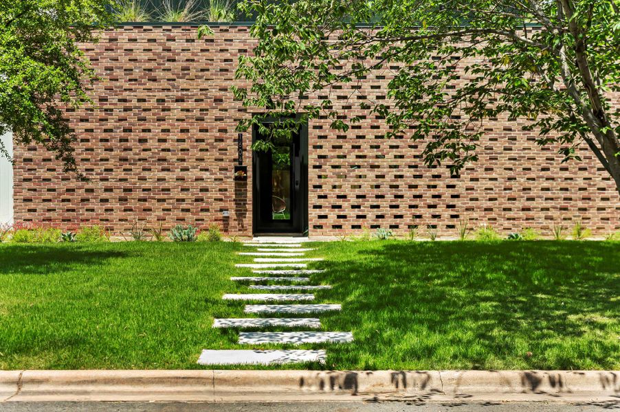 View of front of house with a front lawn and brick siding View of front of house with a front lawn and brick siding
