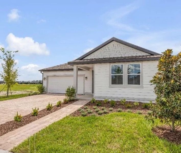 Front exterior of a new home in Ardisia Park, New Smyrna Beach, FL, highlighting curb appeal (Image 2). Front exterior of a new home in Ardisia Park, New Smyrna Beach, FL, highlighting curb appeal (Image 2).