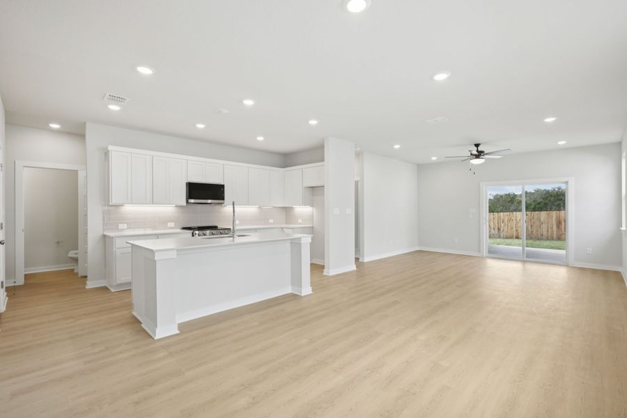 A large kitchen with white cabinets.