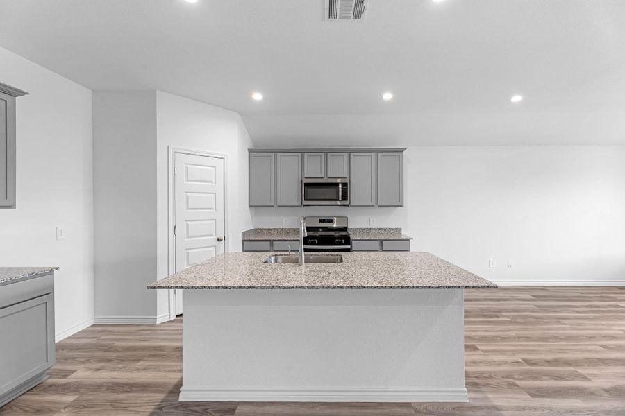 Furnished interior view inside a new home in Reserve at Mallard Lakes, Orange (Image 7).