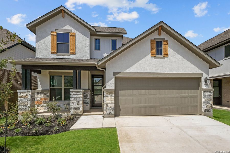 Front exterior of a new home in Stillwater Ranch, San Antonio, TX, highlighting curb appeal (Image 25). Front exterior of a new home in Stillwater Ranch, San Antonio, TX, highlighting curb appeal (Image 25).