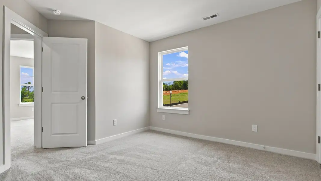 View of entrance to secondary bedroom with window