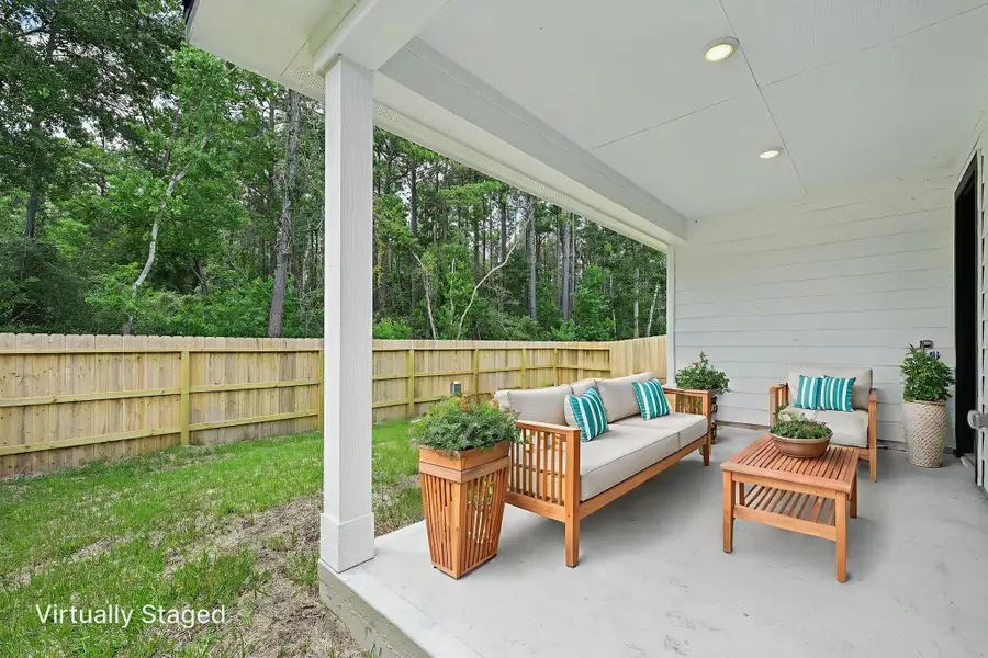 Exterior details and patio area of a home in Landing Meadows - Traditional Series, New Caney (Image 22).