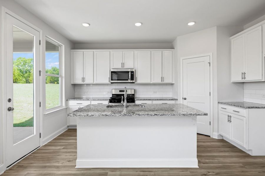 Representative furnished interior of a home built from the Atkinson by UnionMain Homes in Austin Springs, Bethlehem (Image 7).