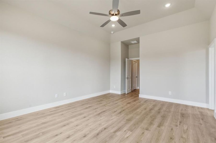 Spare room with ceiling fan and light hardwood / wood-style flooring