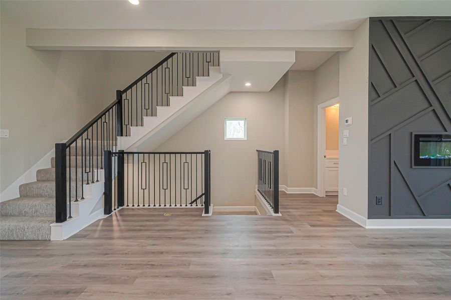 Unit 2: Living room with luxury vinyl flooring.