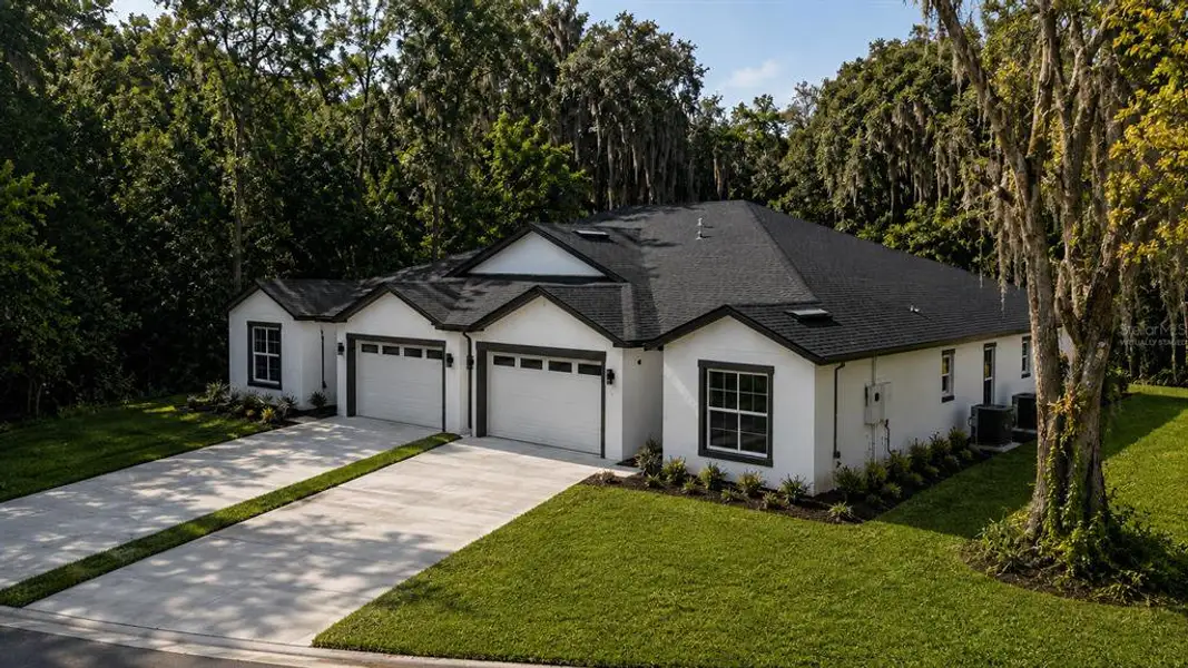 Front exterior of a new home in , Oviedo, FL, highlighting curb appeal (Image 2). Front exterior of a new home in , Oviedo, FL, highlighting curb appeal (Image 2).