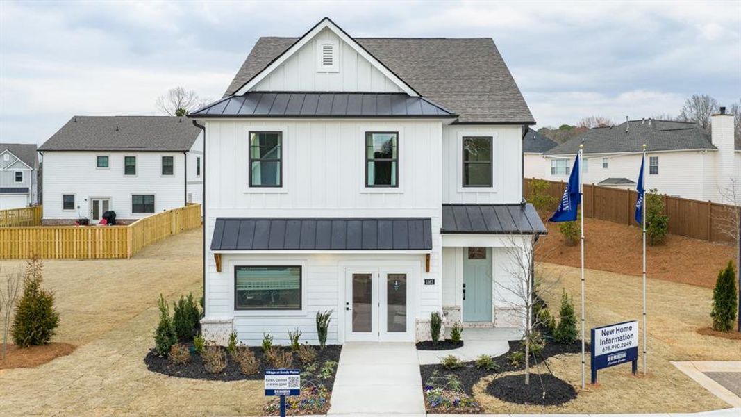 Front exterior of a new home in The Village at Sandy Plains, Marietta, GA, highlighting curb appeal (Image 23).