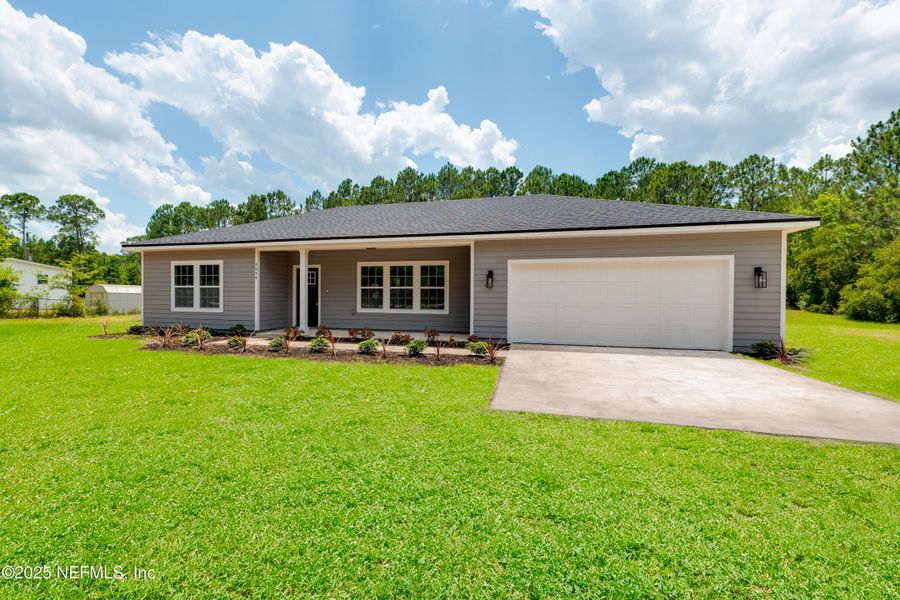 Front exterior of a new home in , Middleburg, FL, highlighting curb appeal (Image 16).