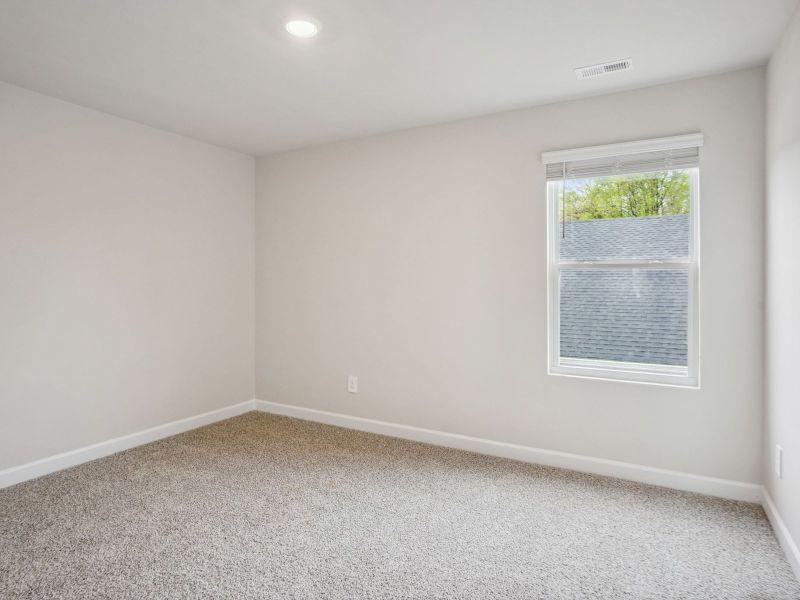 The secondary bedroom is perfect for guests or visitors.