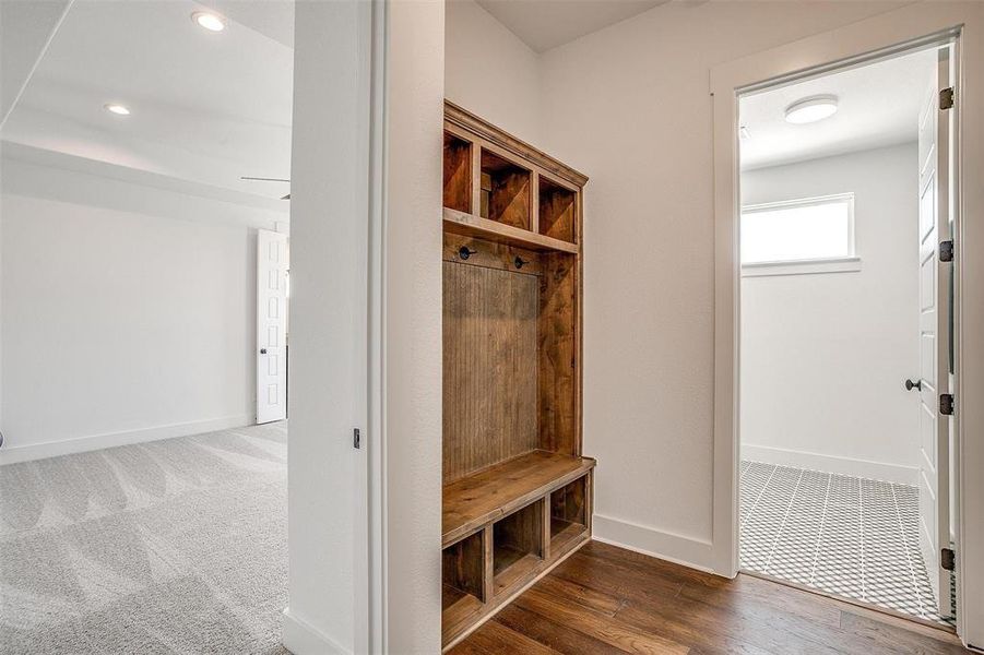 Mudroom featuring dark wood-type flooring