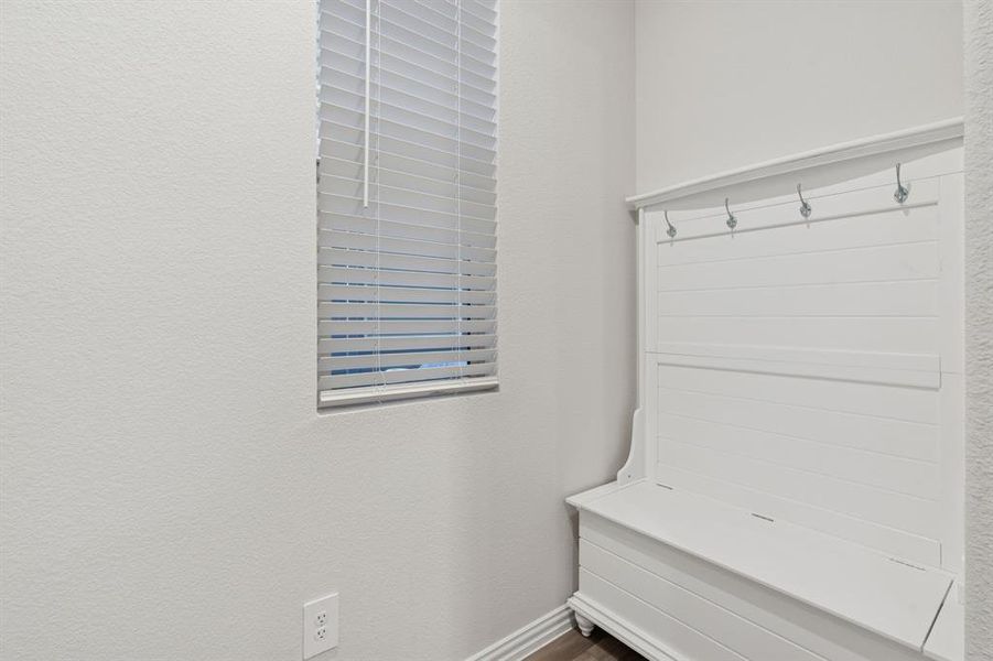 Mudroom featuring a textured wall