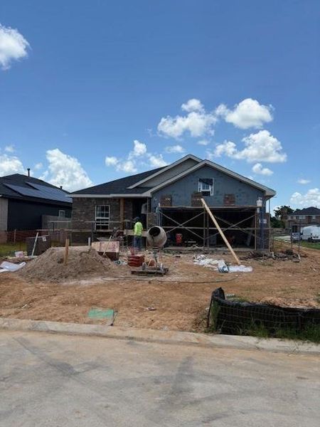 Front exterior of a new home in Bluestem, Brookshire, TX, highlighting curb appeal (Image 1). Front exterior of a new home in Bluestem, Brookshire, TX, highlighting curb appeal (Image 1).
