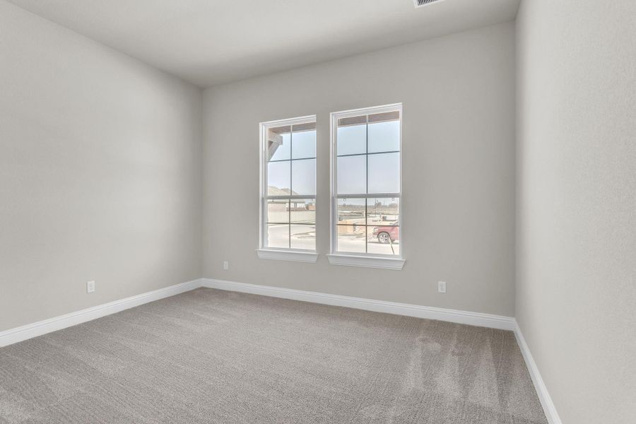 Empty room featuring baseboards and carpet floors Empty room featuring baseboards and carpet floors