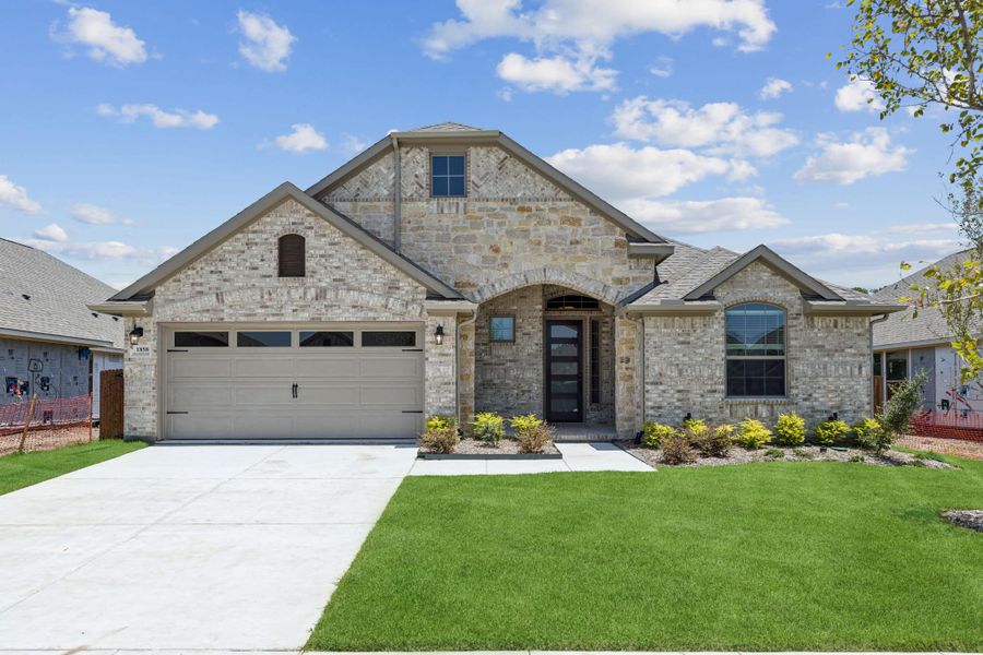 Front exterior of a new home in Las Lomas, Forney, TX, highlighting curb appeal (Image 21).