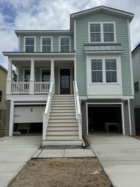 Front exterior of a new home in Oak Bluff, Charleston, SC, highlighting curb appeal (Image 24). Front exterior of a new home in Oak Bluff, Charleston, SC, highlighting curb appeal (Image 24).