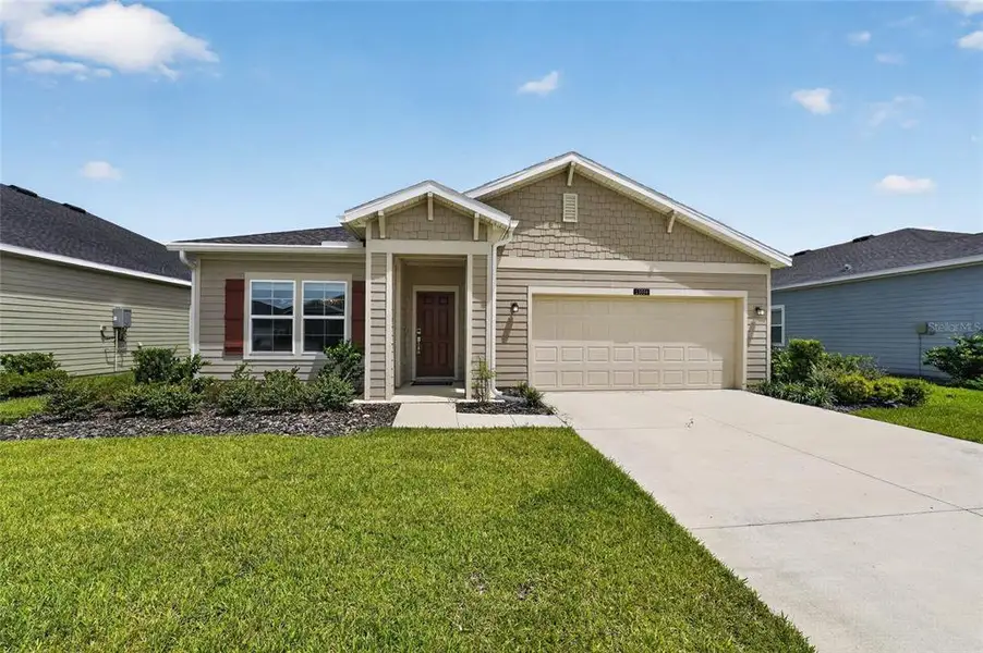Front exterior of a new home in , Alachua, FL, highlighting curb appeal (Image 1). Front exterior of a new home in , Alachua, FL, highlighting curb appeal (Image 1).