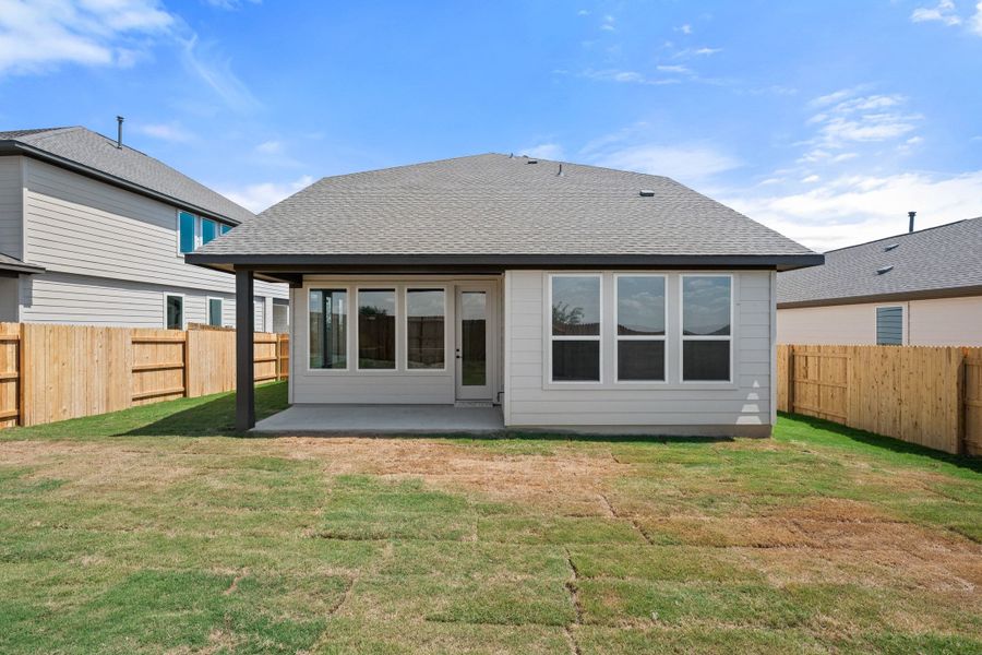Exterior details and patio area of a home in Terrace Collection At Turner's Crossing, Buda (Image 32).