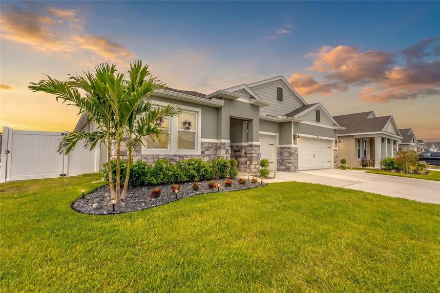 Front exterior of a new home in Harmony West, Harmony, FL, highlighting curb appeal (Image 26). Front exterior of a new home in Harmony West, Harmony, FL, highlighting curb appeal (Image 26).