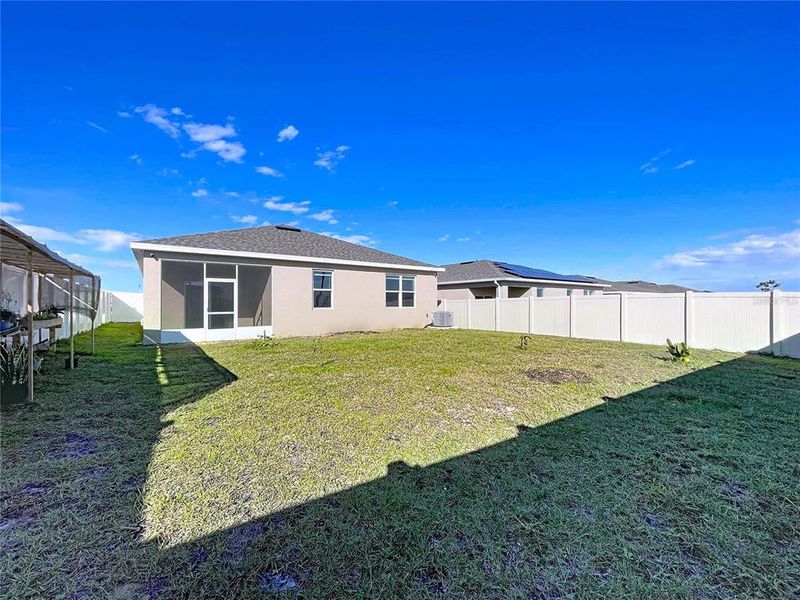 Exterior details and patio area of a home in Covered Bridge at Liberty Bluff, Haines City (Image 30).