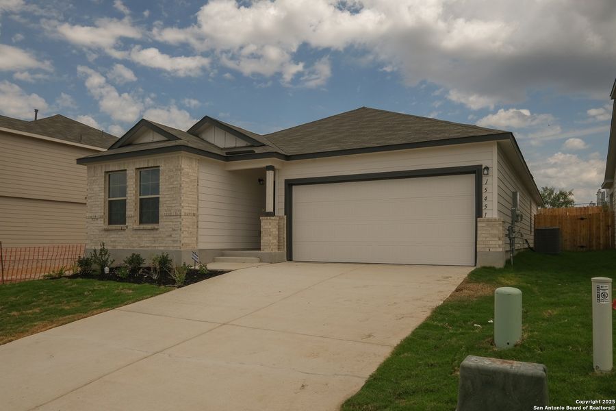 Front exterior of a new home in Hunters Ranch, San Antonio, TX, highlighting curb appeal (Image 21). Front exterior of a new home in Hunters Ranch, San Antonio, TX, highlighting curb appeal (Image 21).
