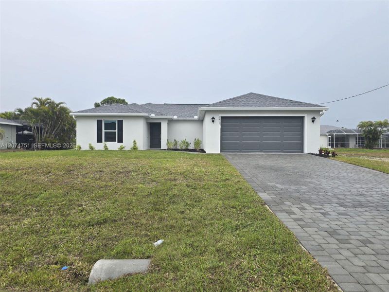 Front exterior of a new home in , Cape Coral, FL, highlighting curb appeal (Image 23).