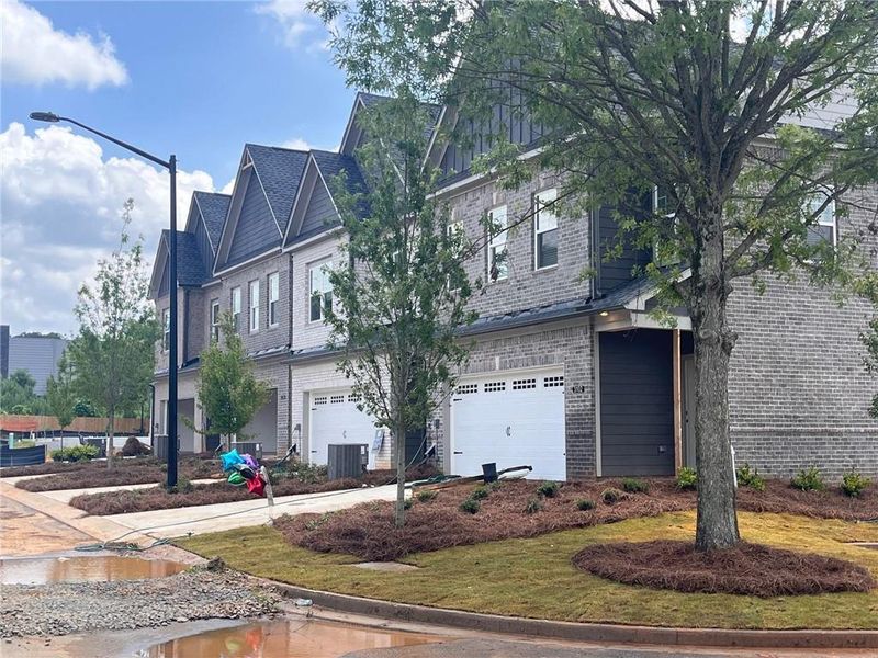 Front exterior of a new home in Governors Parc, Kennesaw, GA, highlighting curb appeal (Image 1).