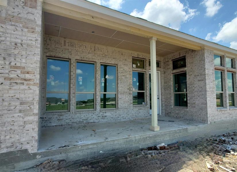 Doorway to property with brick siding and covered porch Doorway to property with brick siding and covered porch