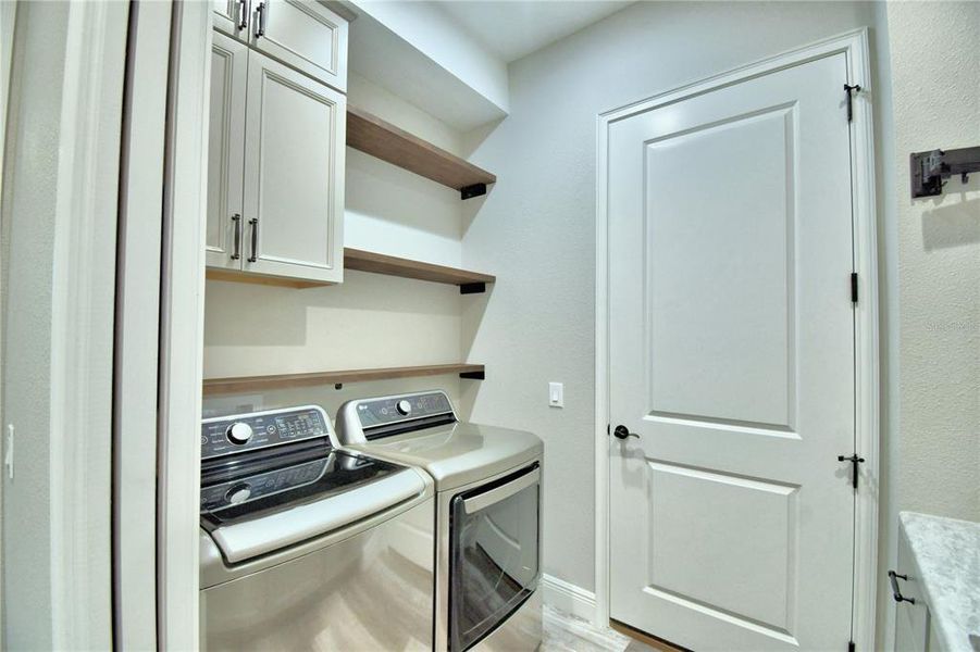 Laundry Room With Built in Shelving