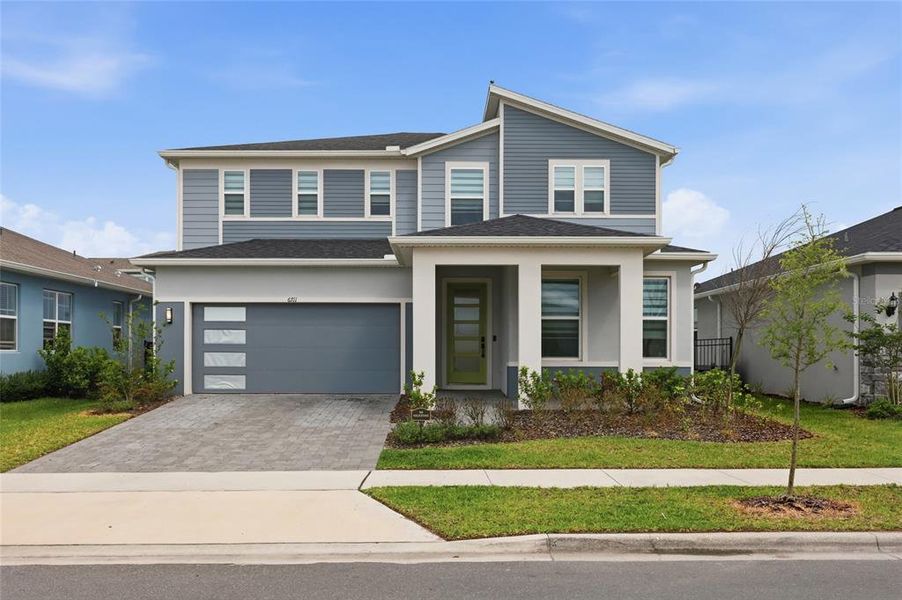 Front exterior of a new home in , Orlando, FL, highlighting curb appeal (Image 32).