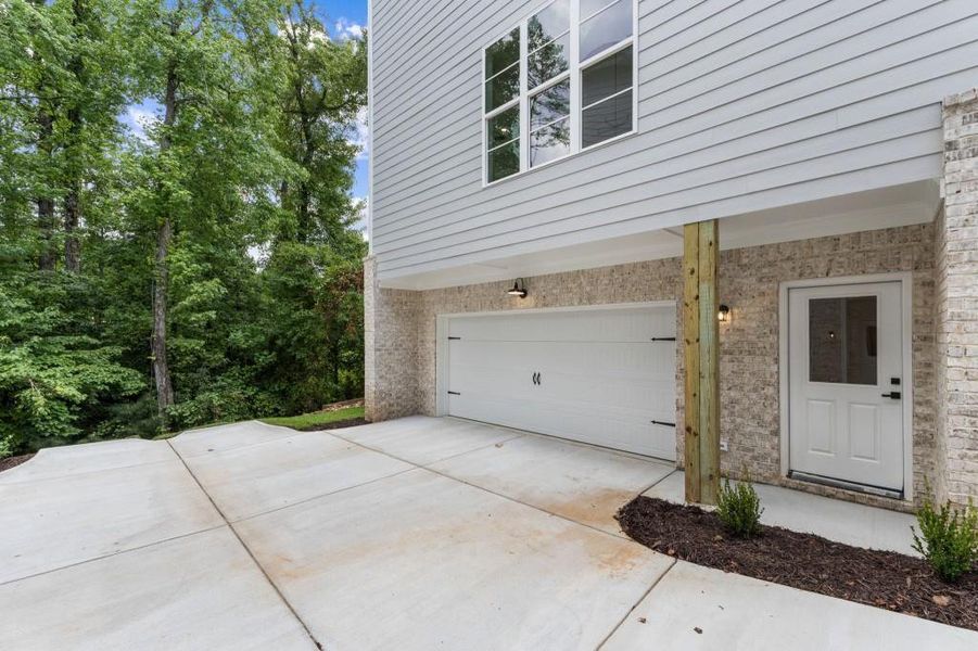 Front exterior of a new home in Parkside Roswell, Roswell, GA, highlighting curb appeal (Image 24).