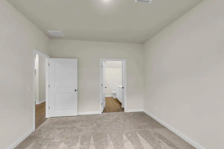 Spacious layout with walk-in closet and ensuite access.