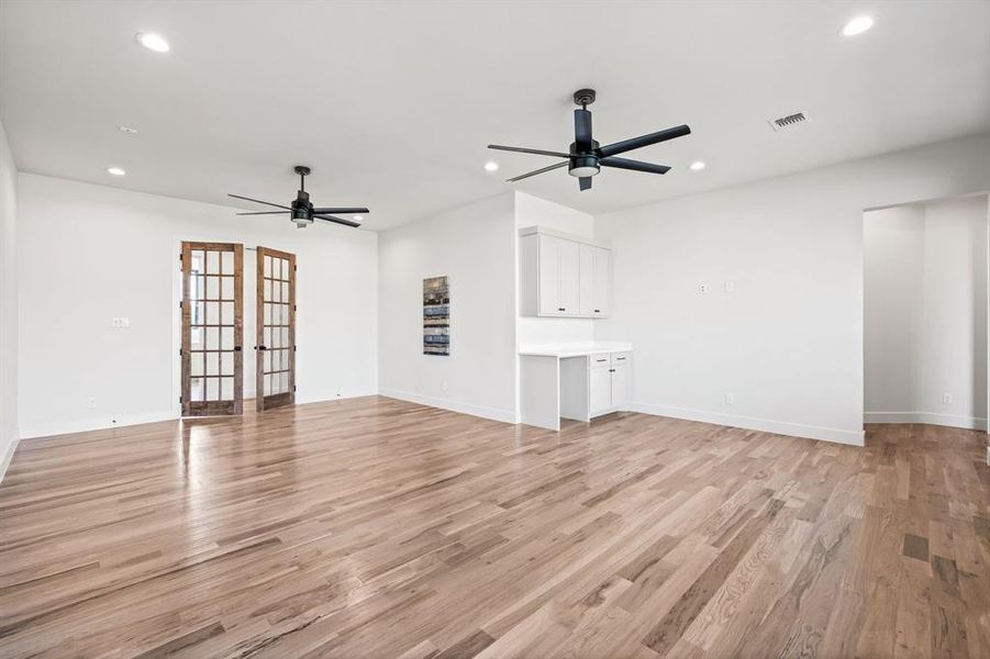 Recreation Room off Back Patio with Built Ins and Room for Beverage Fridge