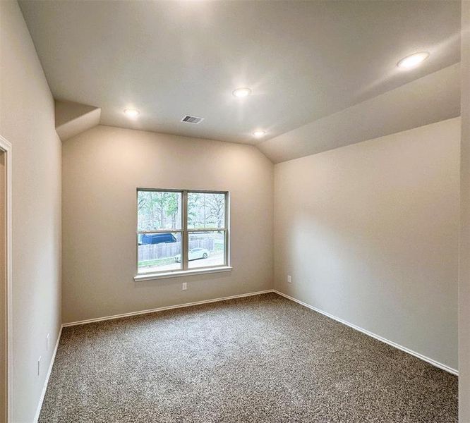 Master bedroom has a soaring vaulted ceiling!  (sample photo of completed plan)