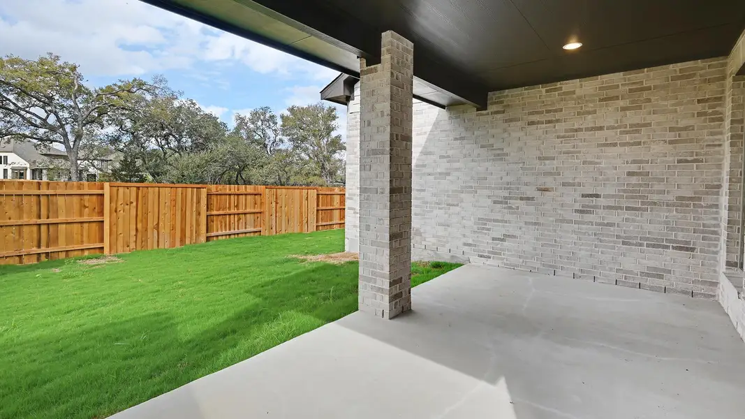 Exterior details and patio area of a home in 6 Creeks 50', Kyle (Image 4).