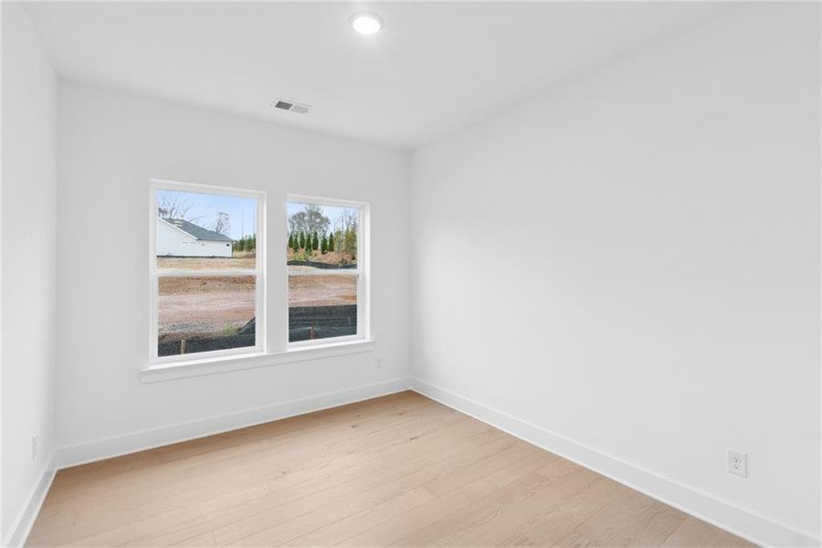 Spacious, unfurnished interior of a new home in Maple Grove at Towne Lake, Woodstock (Image 11).
