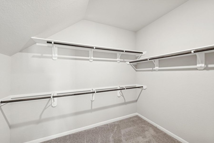 Owner's suite walk-in closet (*Photo not of actual home and used for illustration purposes only.)