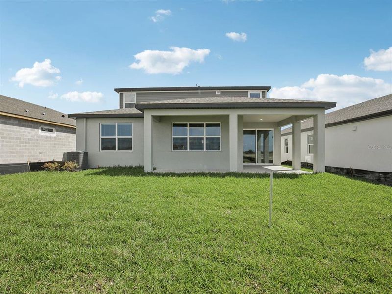 Exterior details and patio area of a home in Coasterra - Reserve Series, Palmetto (Image 26).